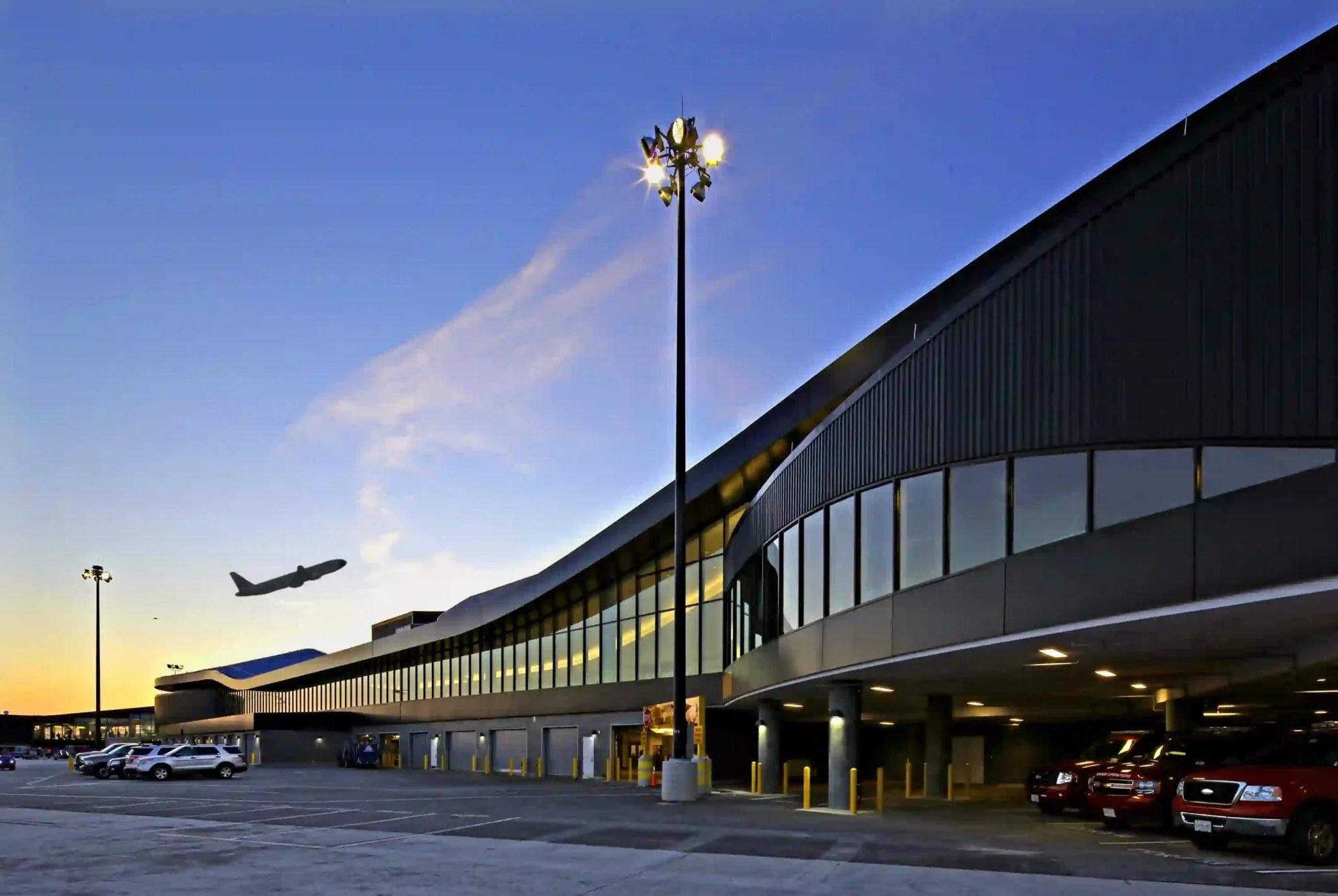 Airport terminal at dusk with a departing flight, near Washington D.C.